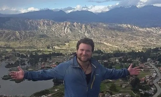 Lior on a mountain trail during a backpacking trip in South America.